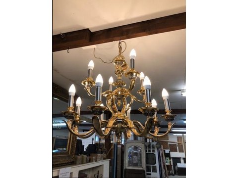 A wonderful 12 Light Chandelier In Brass with pewter inlay