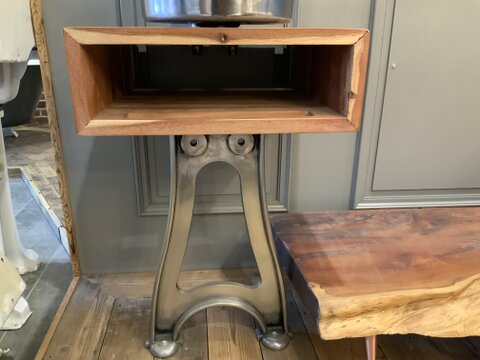 A cast iron single leg stand