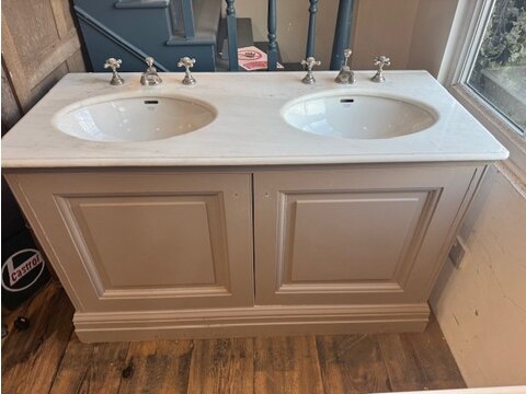 A white marble double sink vanity unit DVU1112